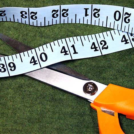 scissors, measure tape on a t-shirt